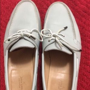 Pair of white john jobb boat shoes